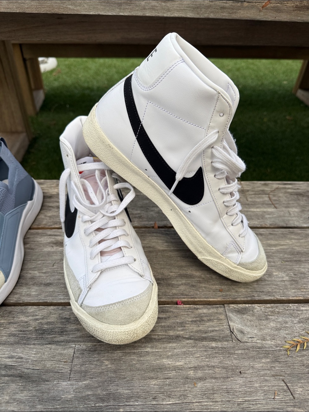 Nike White High-Top Sneakers with Black Swoosh
